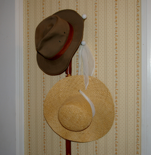 Cyndi's and my hat on the peg by the back door.